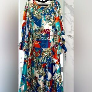 Gorgeous midi dress , crepe material with mild shine and abstract paisley design
